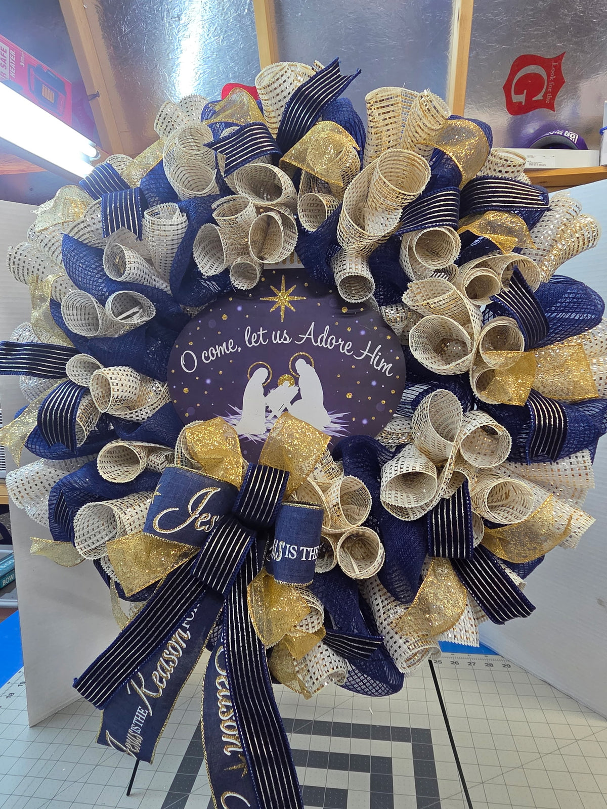O come let us adore him wreath